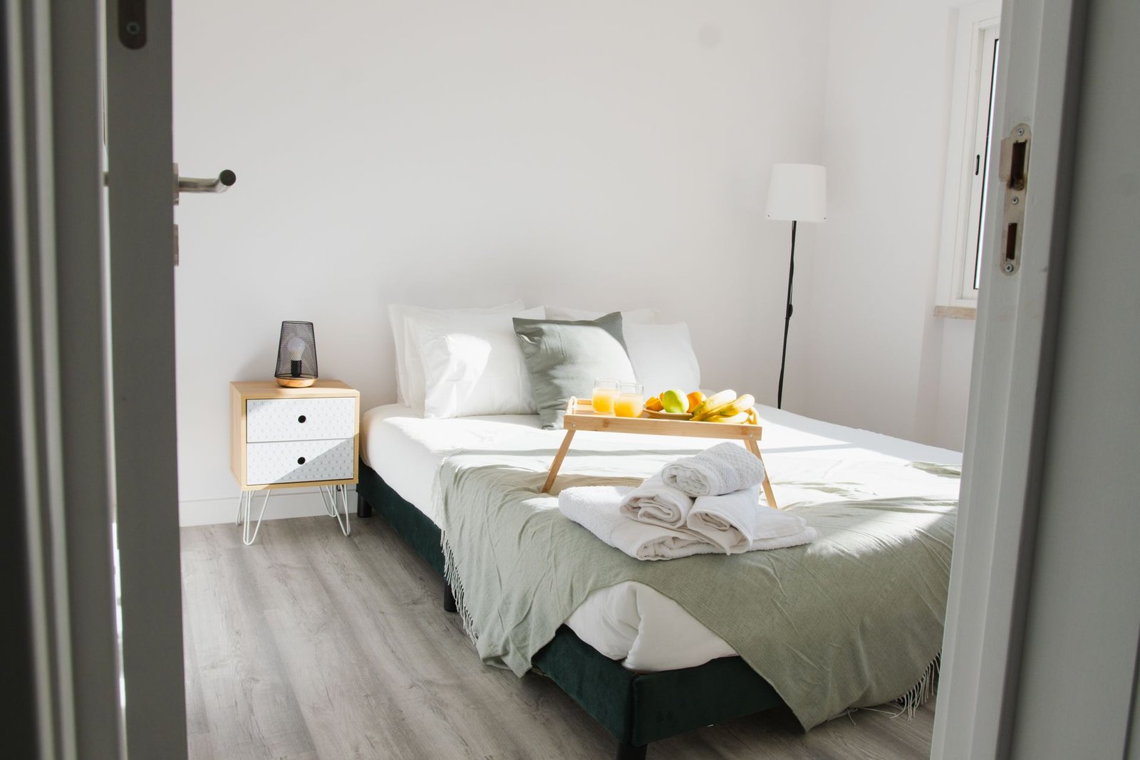 Inviting bedroom interior featuring a comfortable bed with a brea