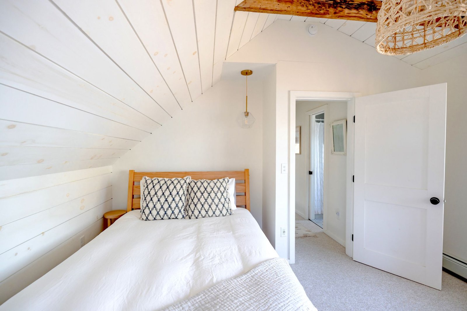 Bright and minimalist bedroom interior with rustic features and n