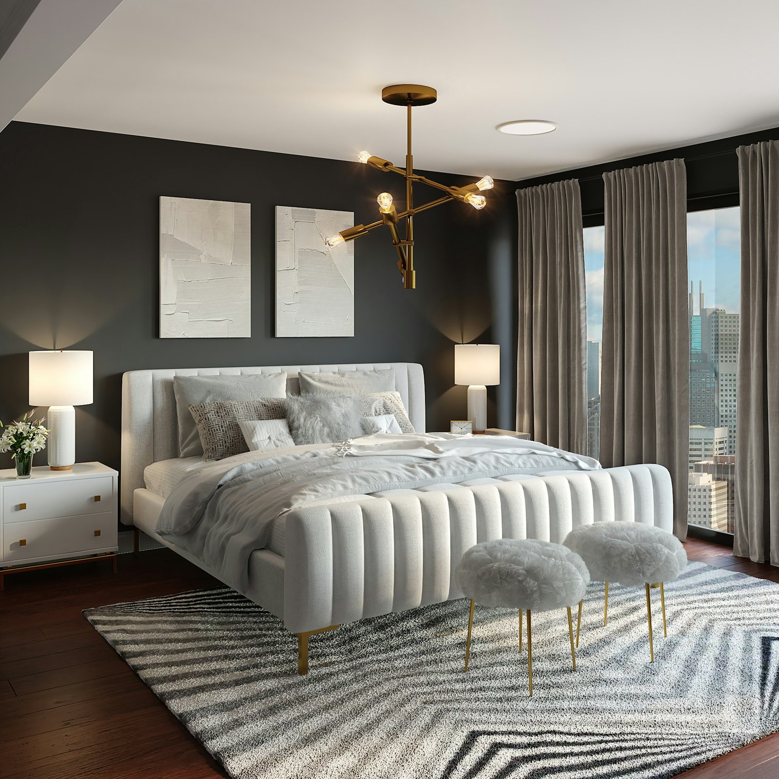 A modern bedroom with a white upholstered bed, gold chandelier, and ci