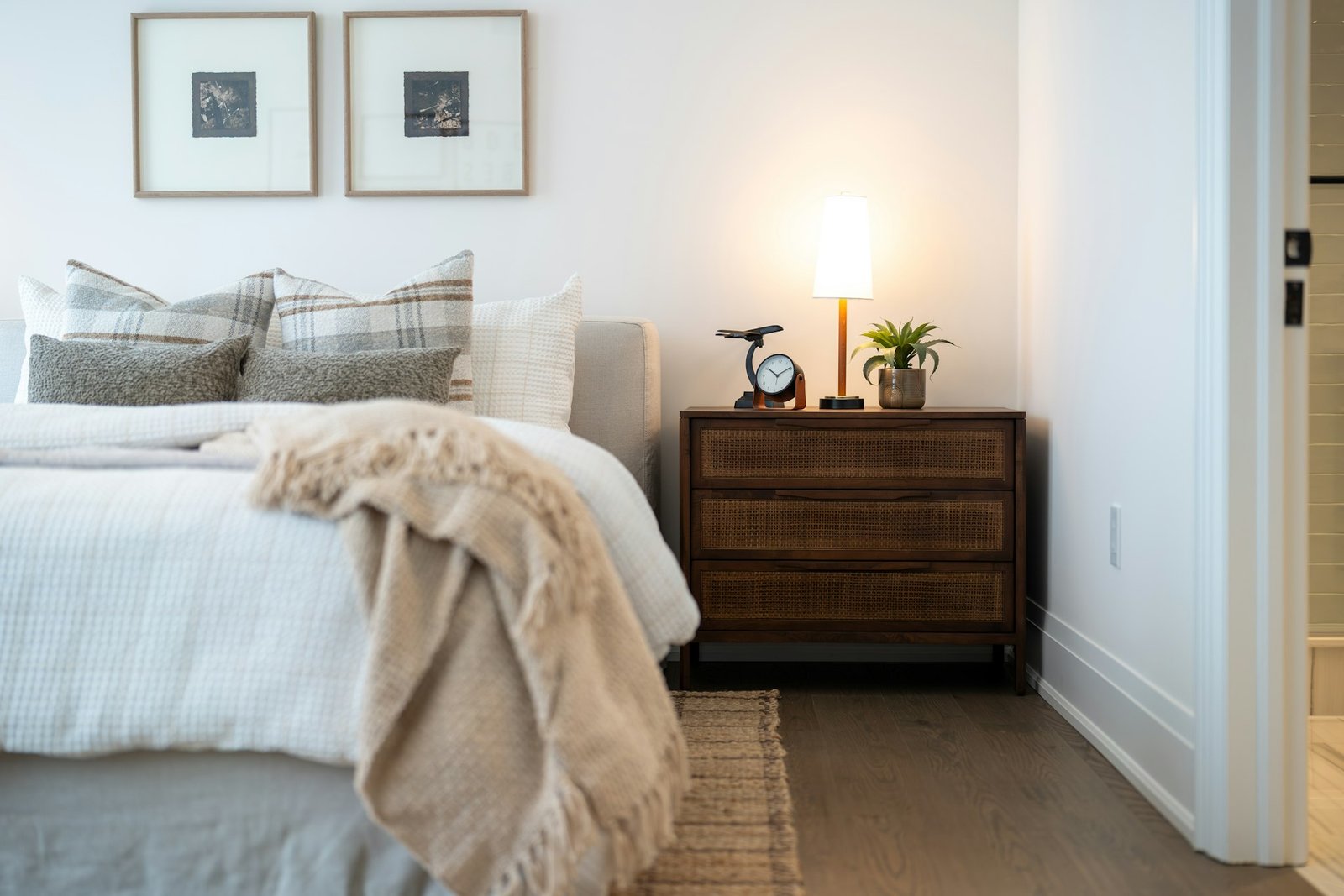A cozy bedroom with a bedside table and lamp