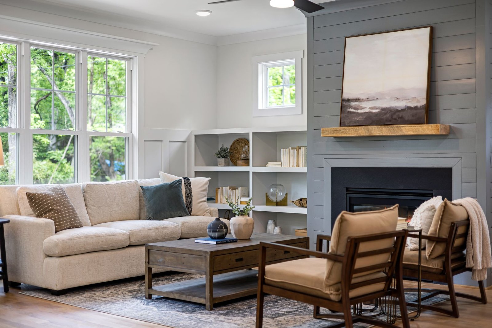 Stylish living room featuring cozy furniture, fireplace, and mode