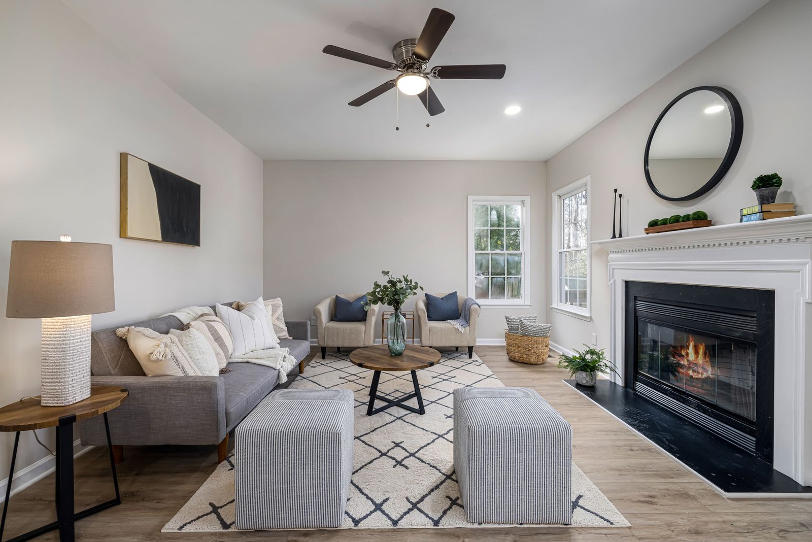 Stylishly decorated living room with fireplace and modern furnitu