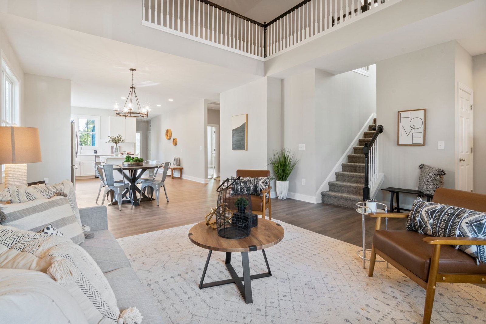 Bright and elegant open concept living room featuring modern furn