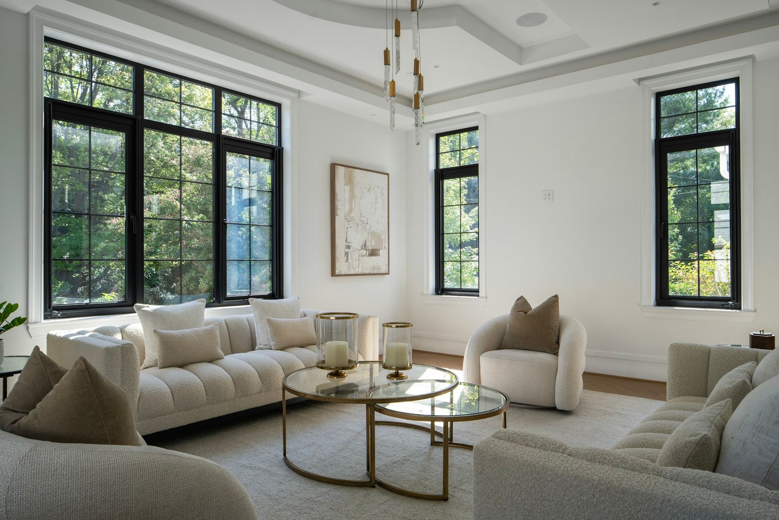 Elegant living room with white furniture and large windows
